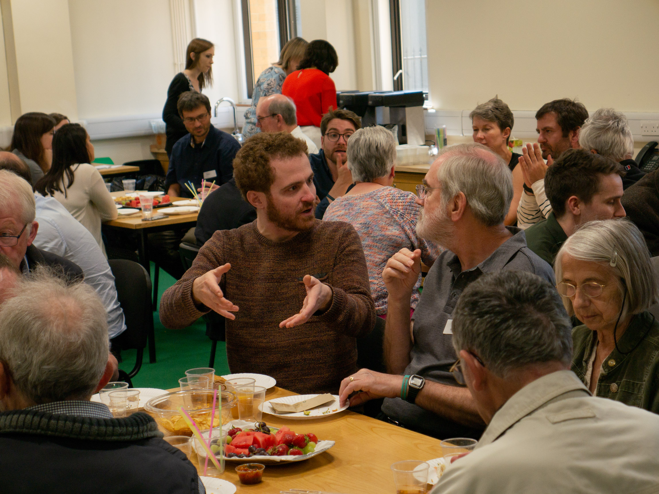 Lay members of Parkinson’s UK chat over lunch with the Unit’s early-career scientists.