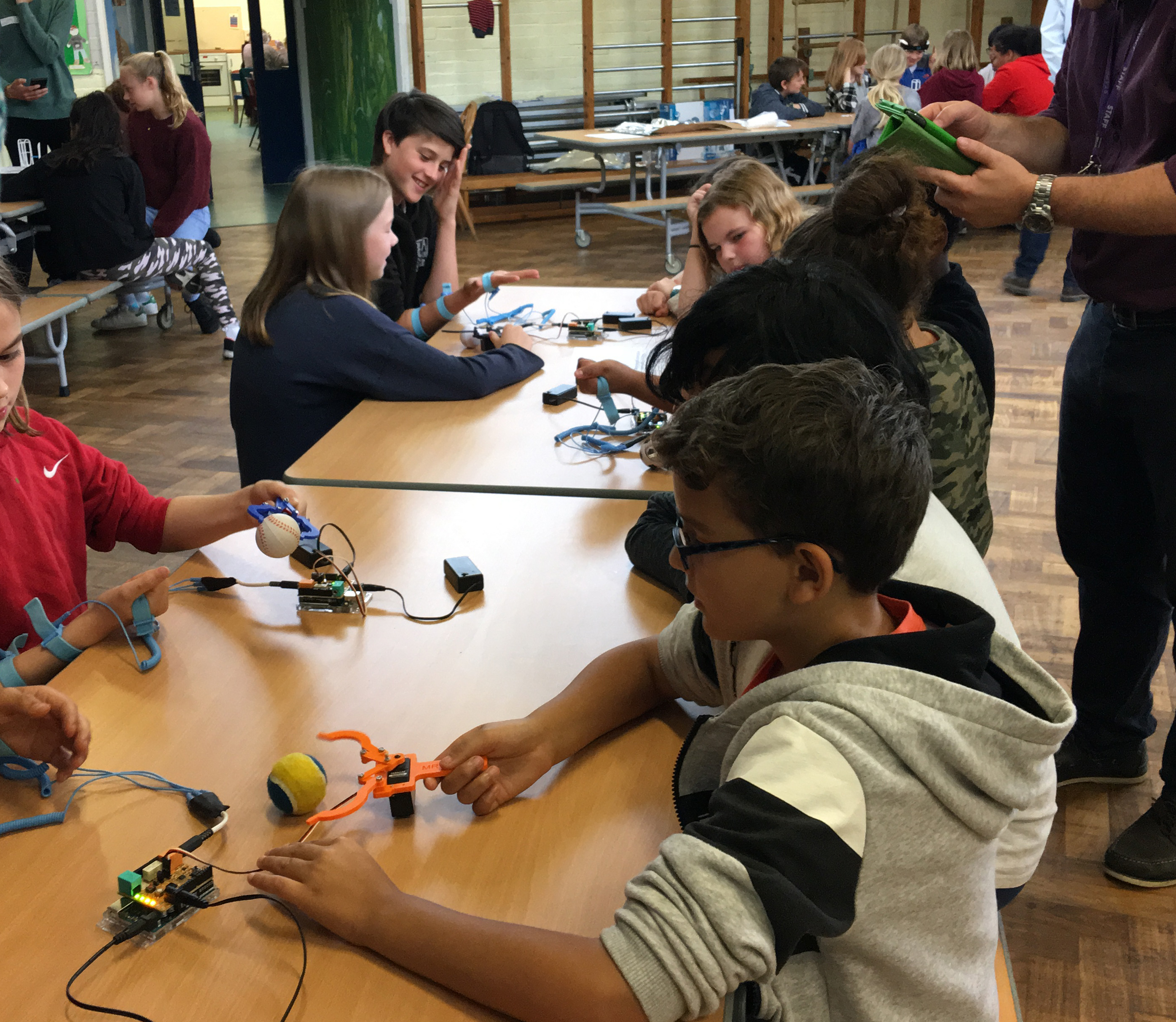 Photo of pupils remotely control robotic devices with their minds and muscles.