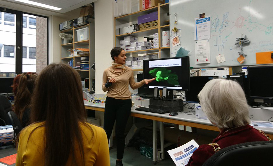 Unit scientist Dr Emilie Syed gives visitors a virtual tour of her research on the electrical activity of nerve cells in the brain.
