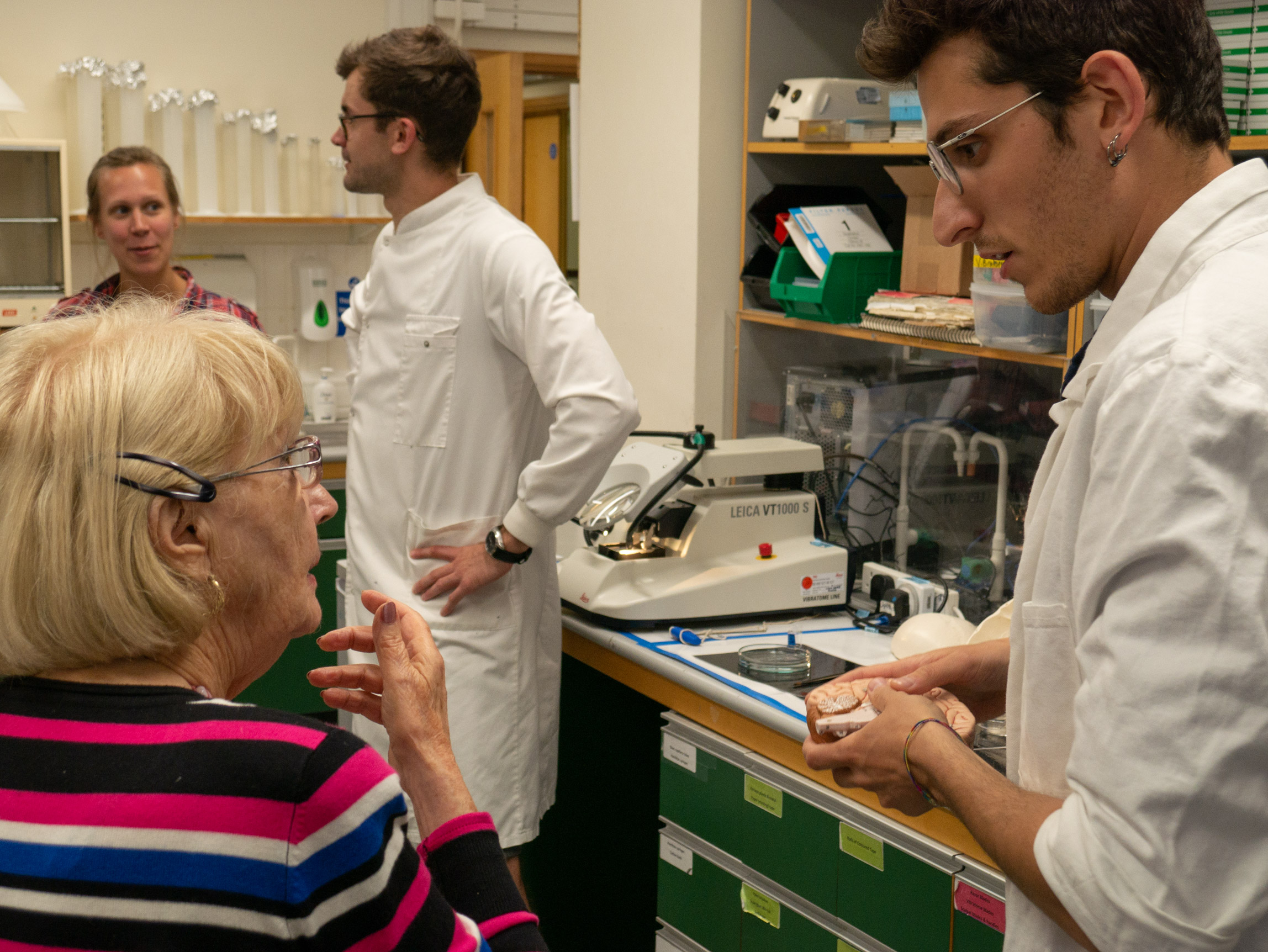 Unit students Luke Bryden (left) and Giulio Spagnol (right) engage visitors with their practical demonstrations of some of the lab equipment and techniques used at the Unit for its research on Parkinson’s disease.