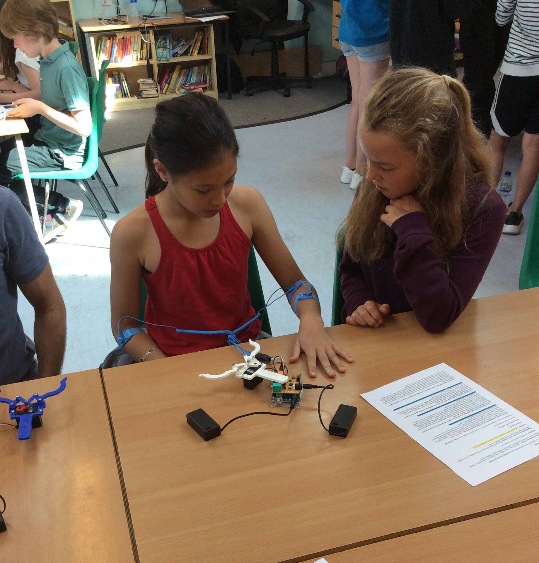 An enthusiastic pupil concentrates hard and tests her brain and muscles!