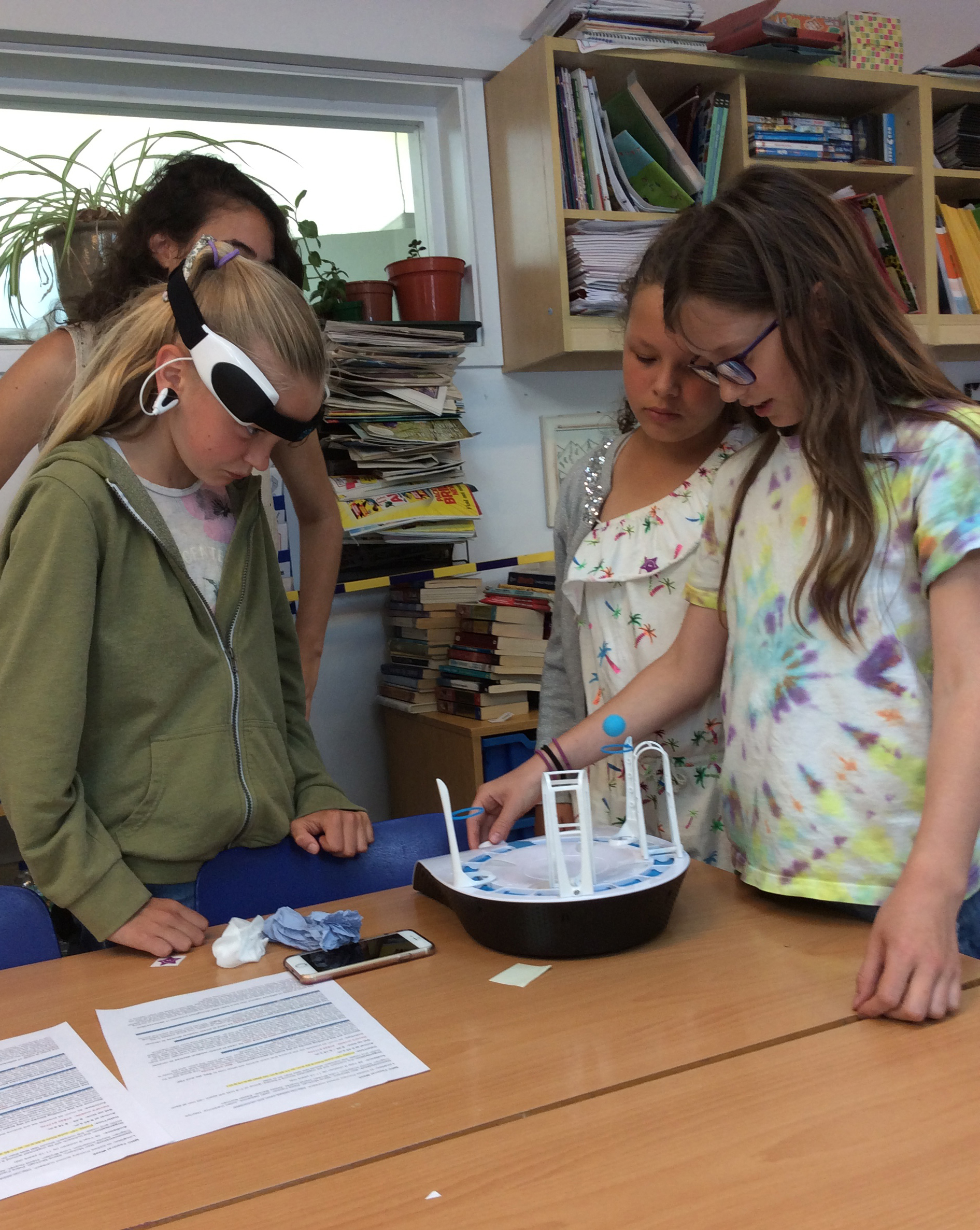 Unit scientist Dr Hayriye Cagnan (back left) encourages pupils to give a live demonstration of their brain power!