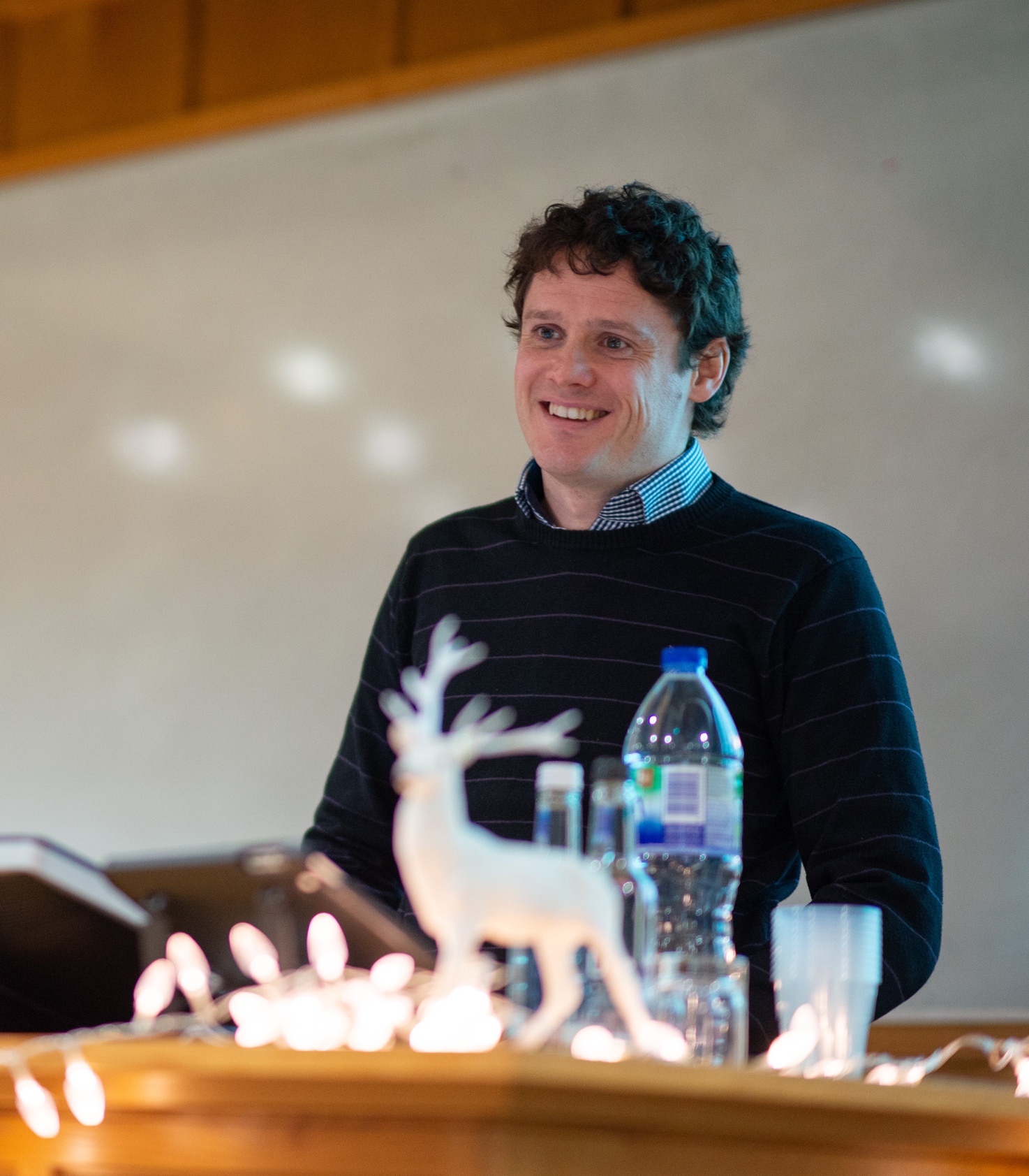 Unit postdoctoral scientist Colin McNamara answers audience questions after presenting his latest research on closed-loop stimulation of the Parkinsonian brain.