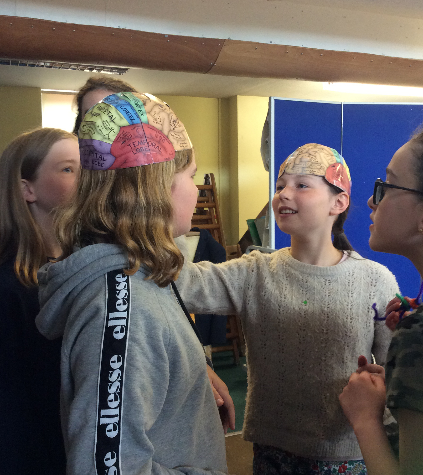 Photo of pupils trying on the “brain hats”.