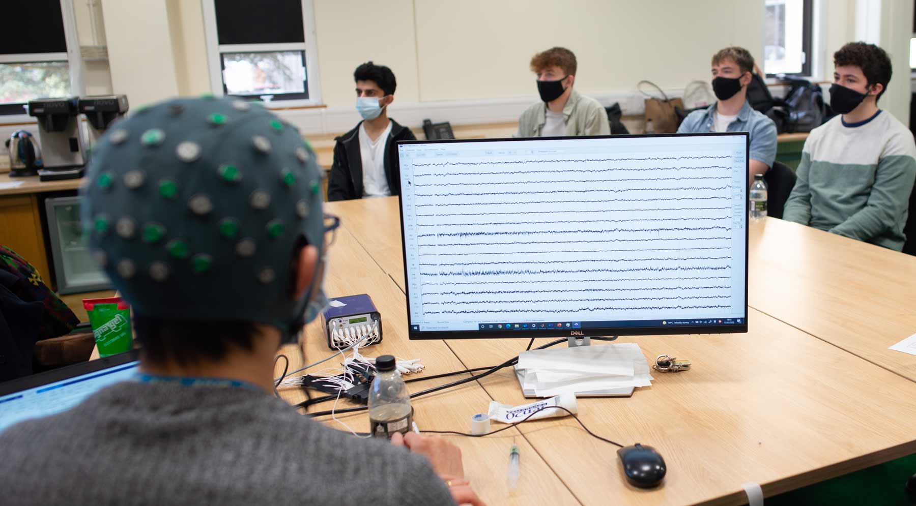 Photo of Shenghong He, together with school pupils visiting the MRC BNDU.