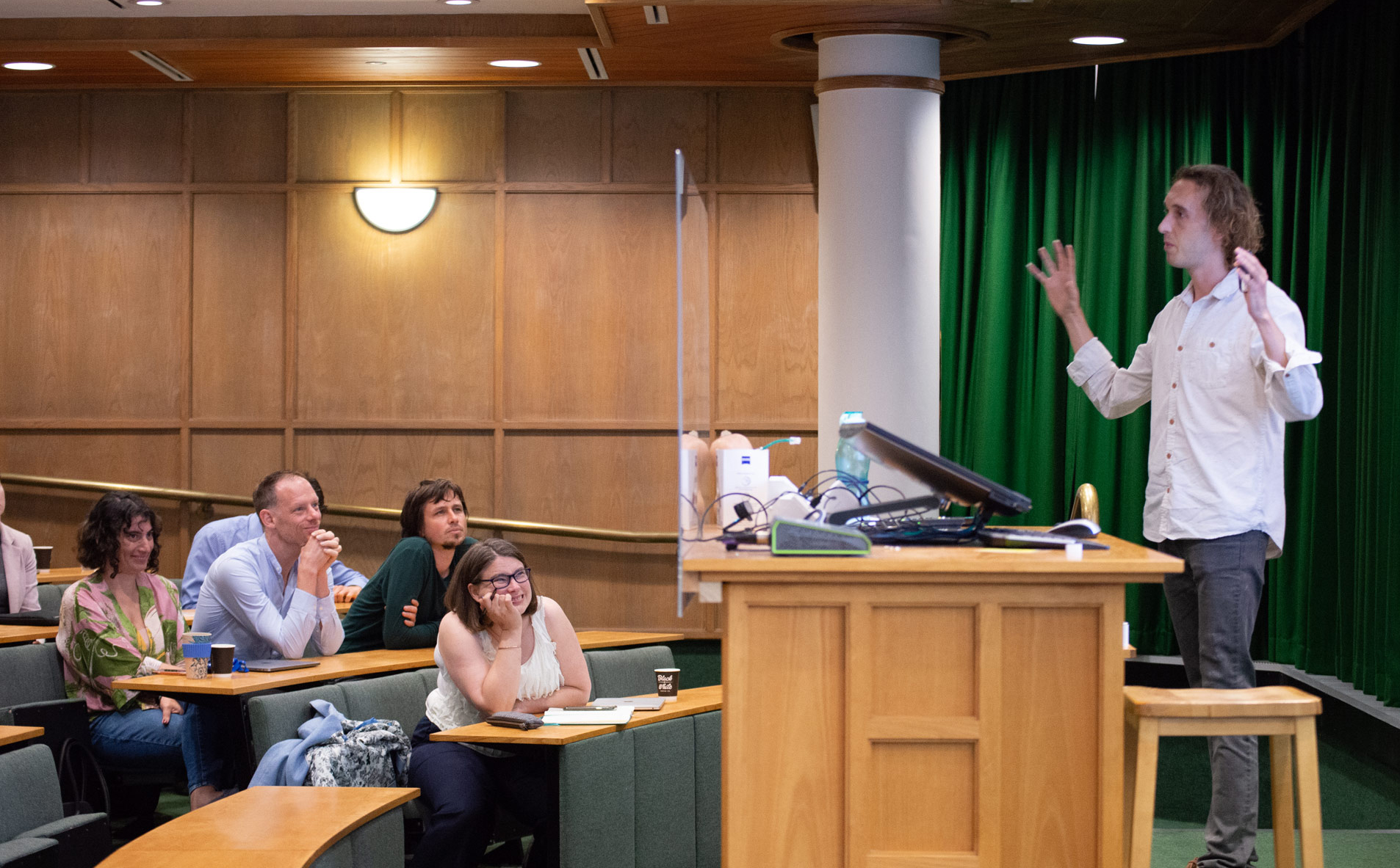 A photo of Charlie Clarke-Williams presenting his research to Unit colleagues.