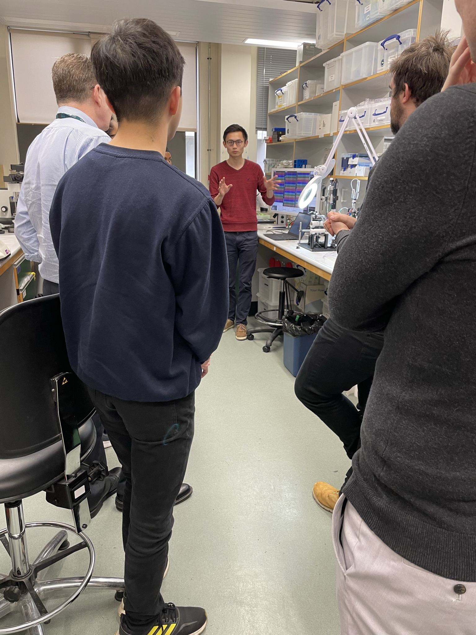 Photo of Yangfan Peng, together with school pupils visiting the MRC BNDU.