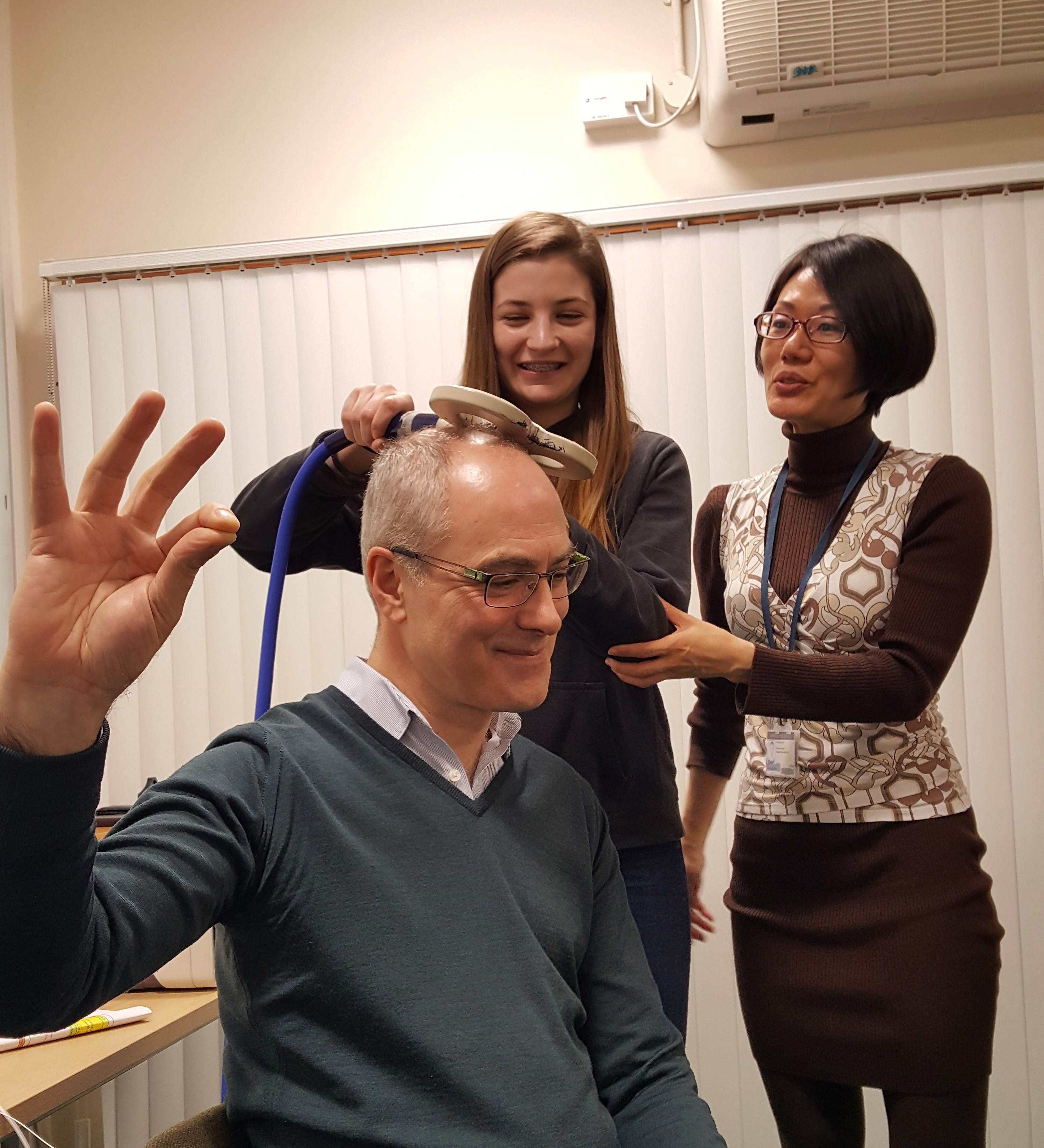 Pupils enthusiastically get to grips with the science of brain stimulation (as demonstrated on everyone’s favourite “volunteer”, Unit Director Professor Peter Brown!)