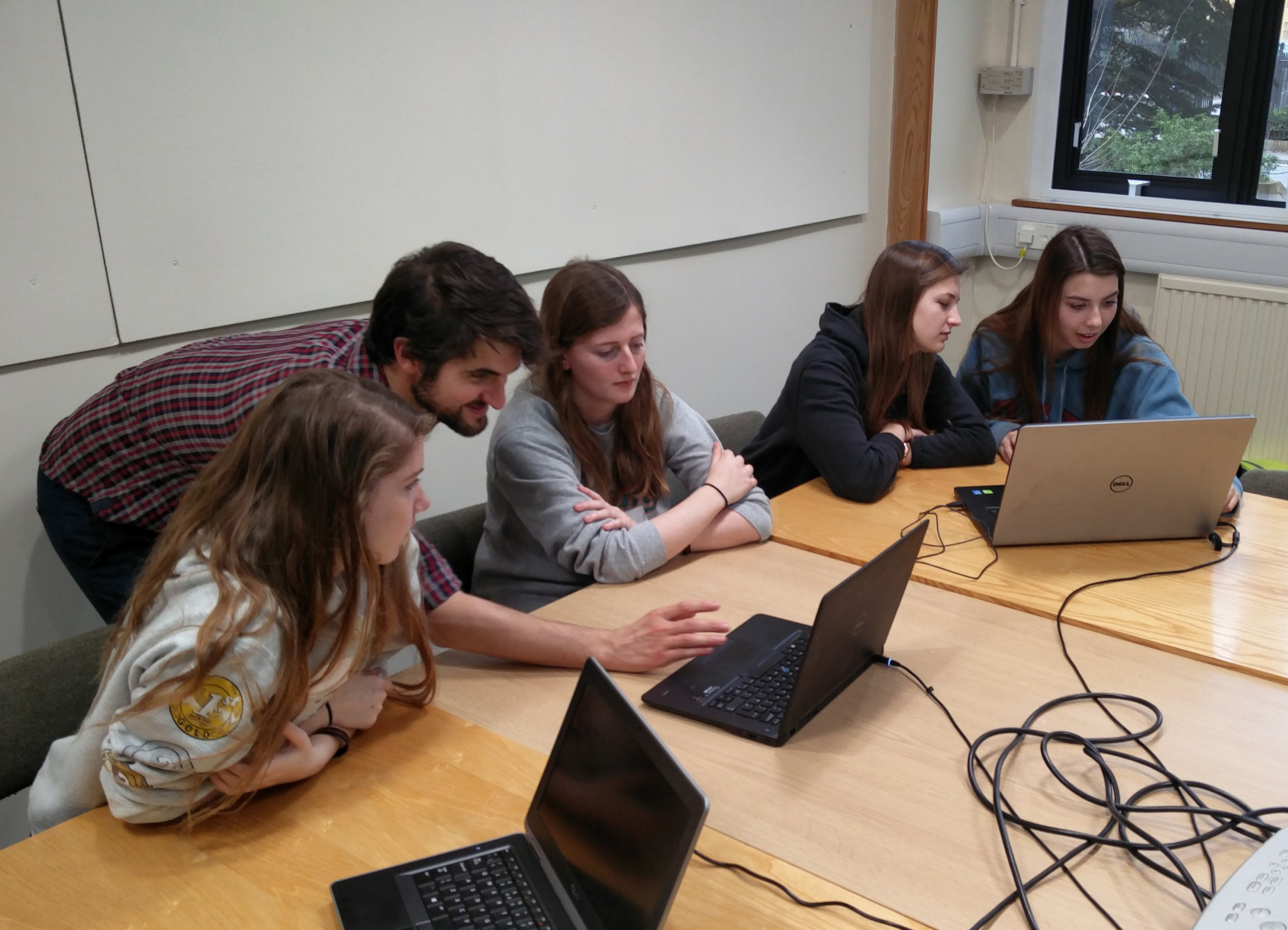 Unit scientist Dr Eduardo Martin Moraud guides pupils as they explore computational models of brain function.