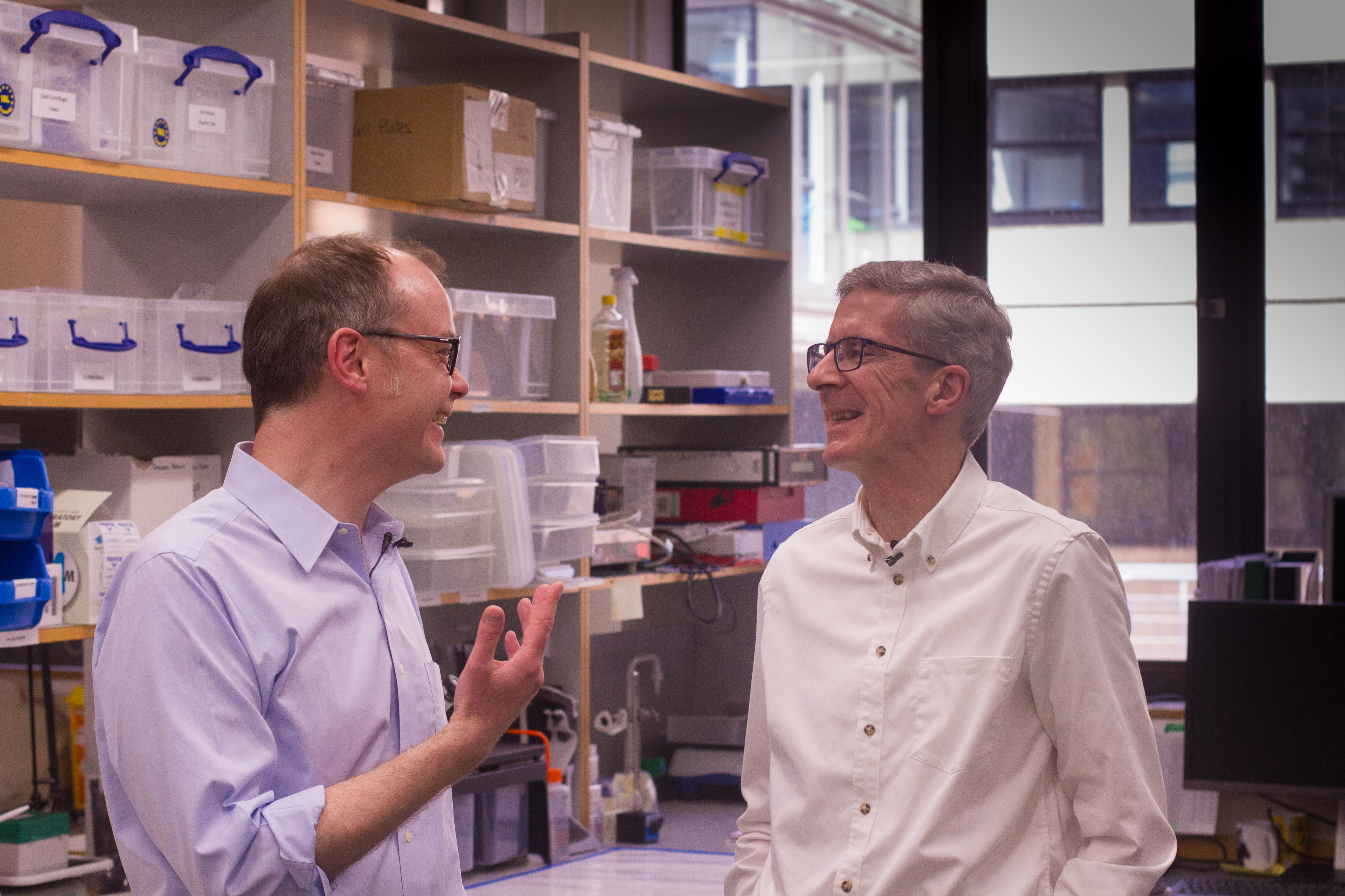 Unit scientist Peter Magill and Parkinson’s UK member Kevin McFarthing chat in the lab about the MRC BNDU’s research into Parkinson’s disease.