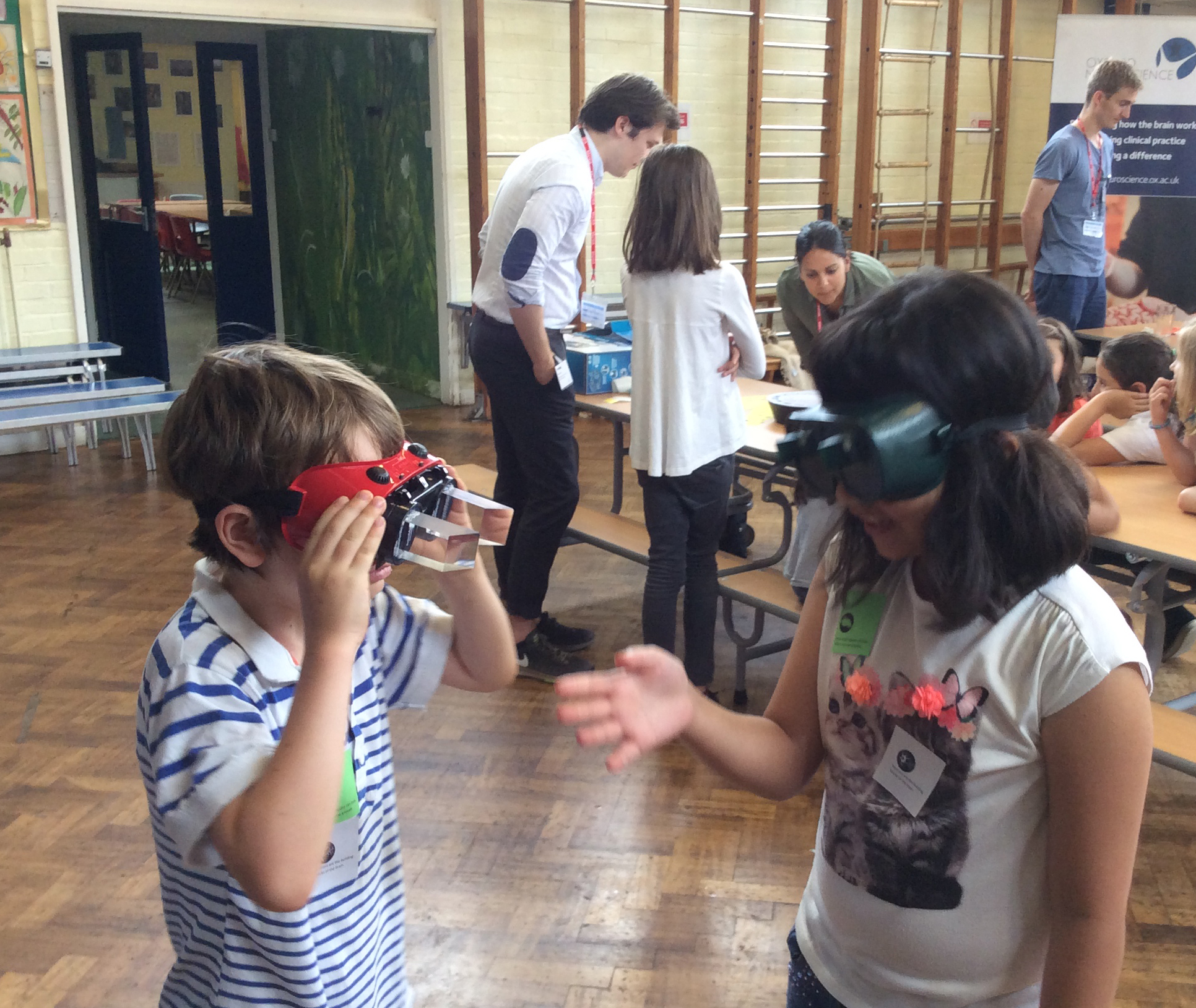 Two pupils use goggles from the Unit’s Public Engagement Toolbox to explore how the brain learns and controls movement.