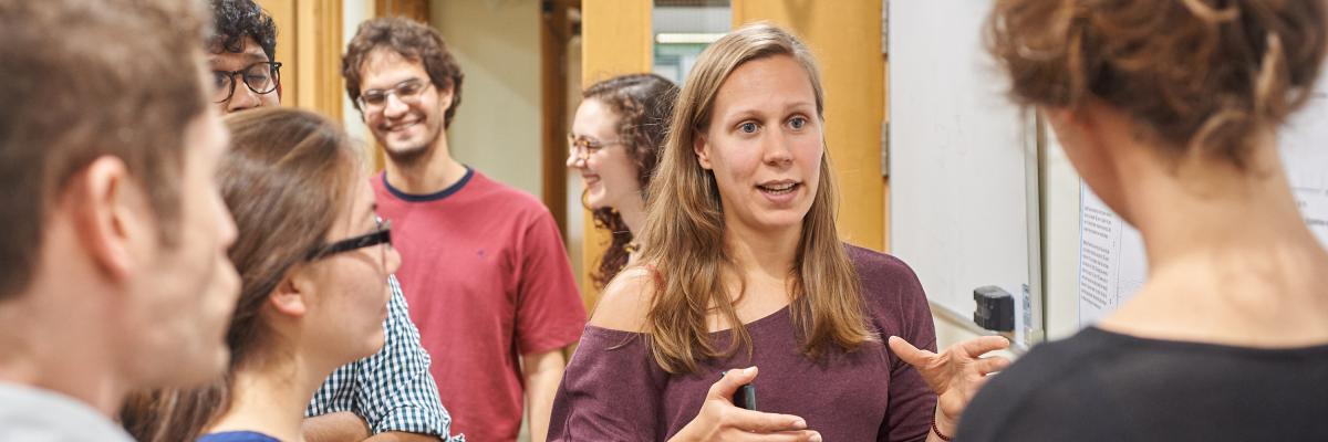 photo of people in discussion at posters