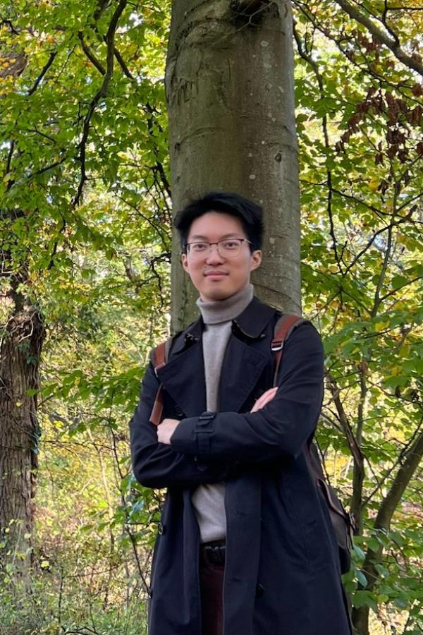 portrait photo of Yichen Xu in a woodland