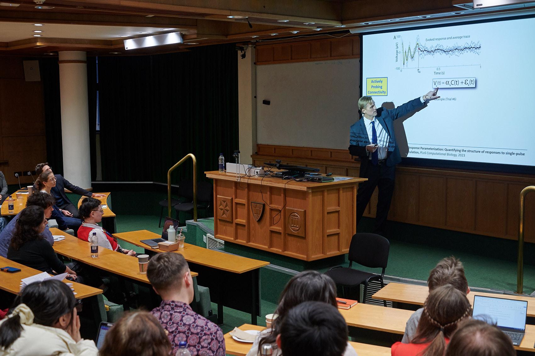 A photo of Professor Kai Miller presenting his research at Winter Science Day 2023. 