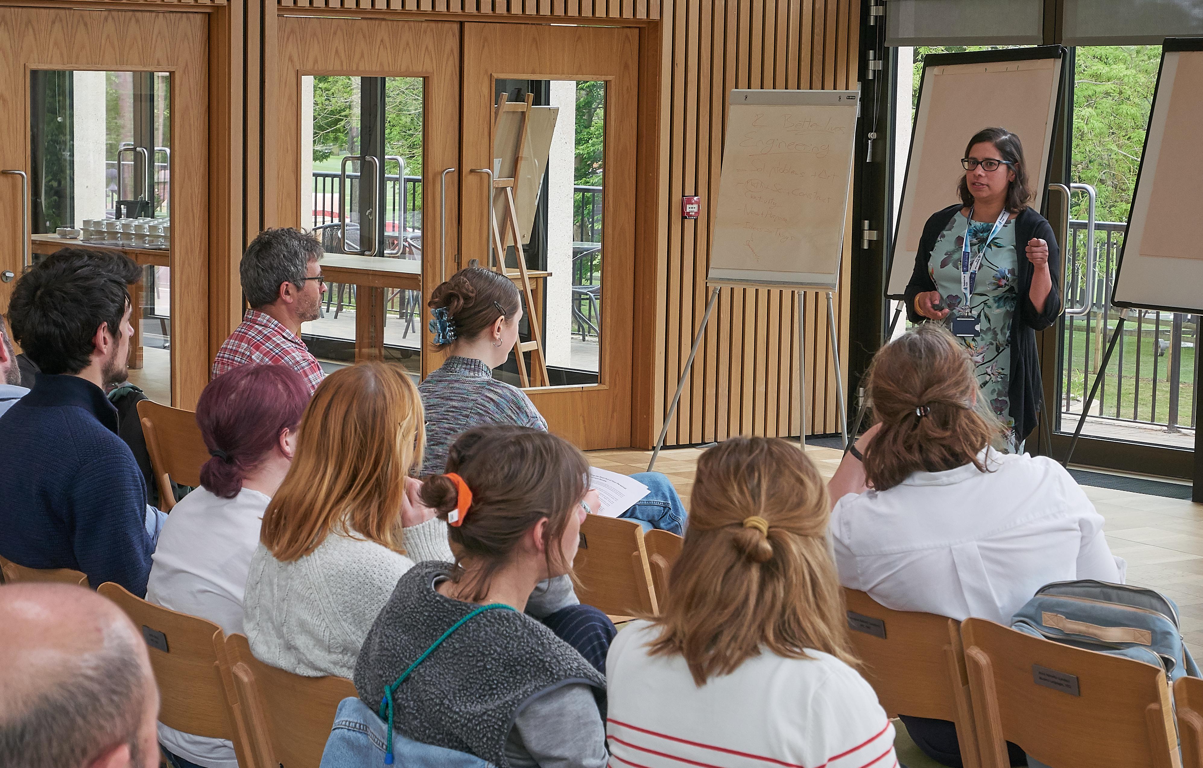 Photo of Vani Naik talking to the audience at the Unit Training and Careers Development Event 2025.