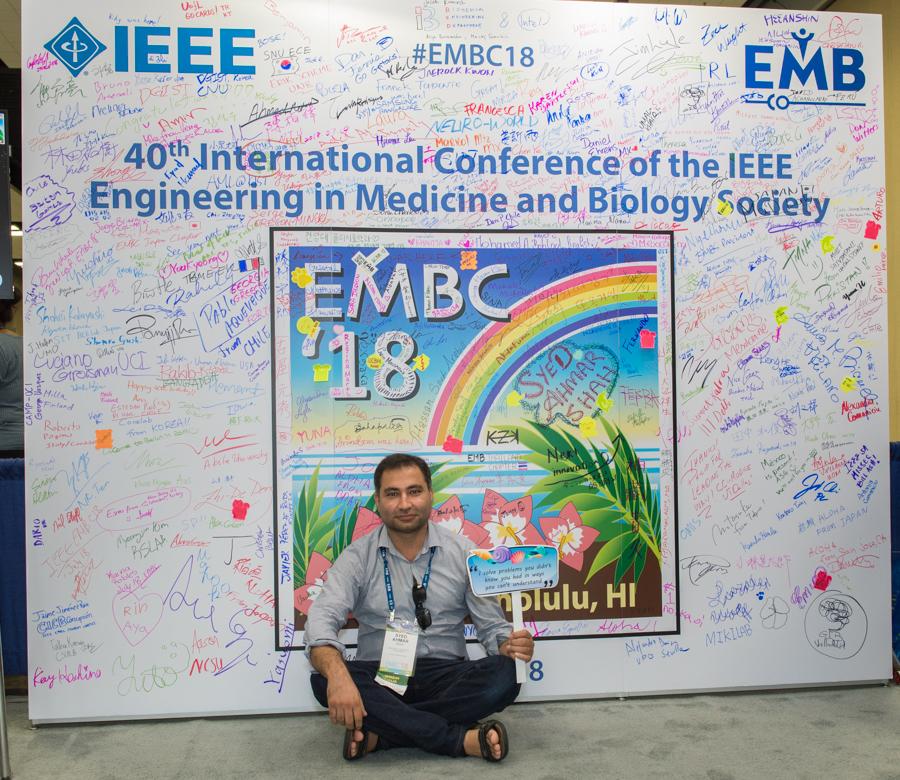 Ahmar takes a moment to rest at the IEEE conference in Hawaii.